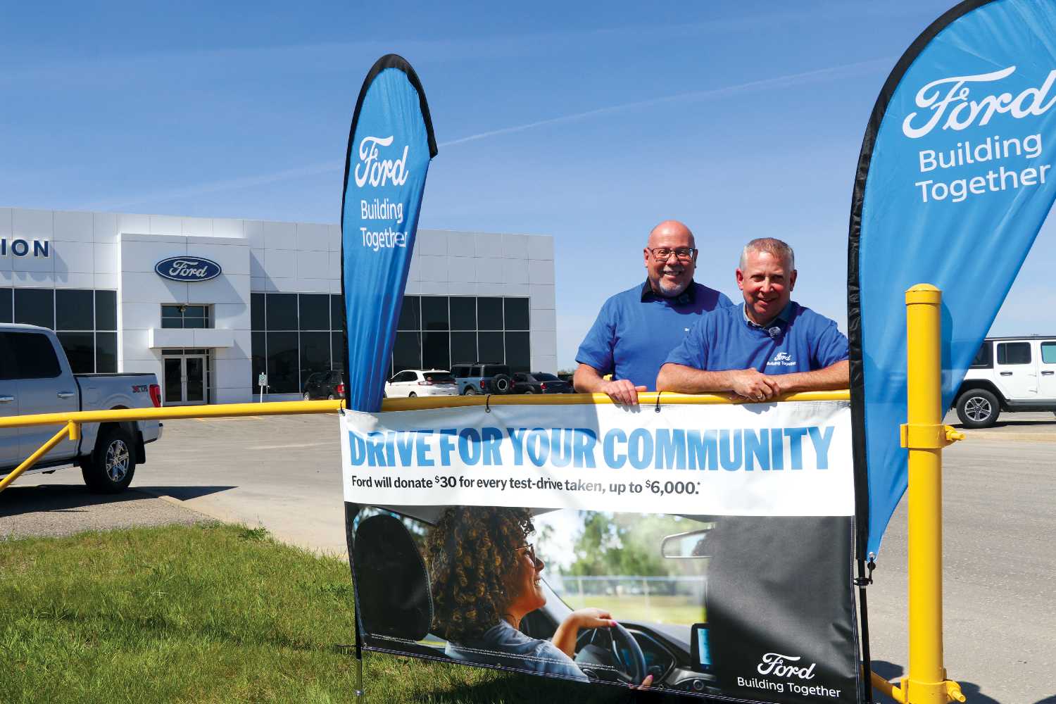 MLA Kevin Weedmark and owner of Celebration Ford Tyler Thorn promoting Drive For Your Community. 